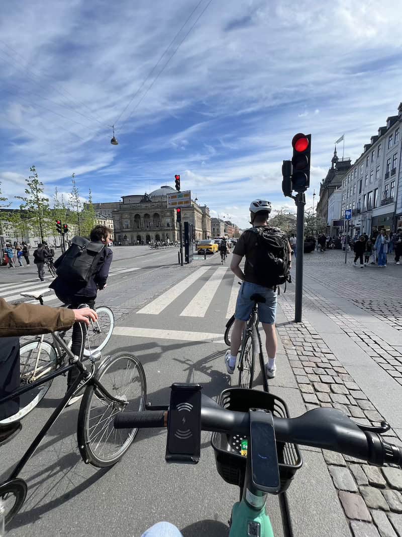 Students cycling through central Copenhagen city streets