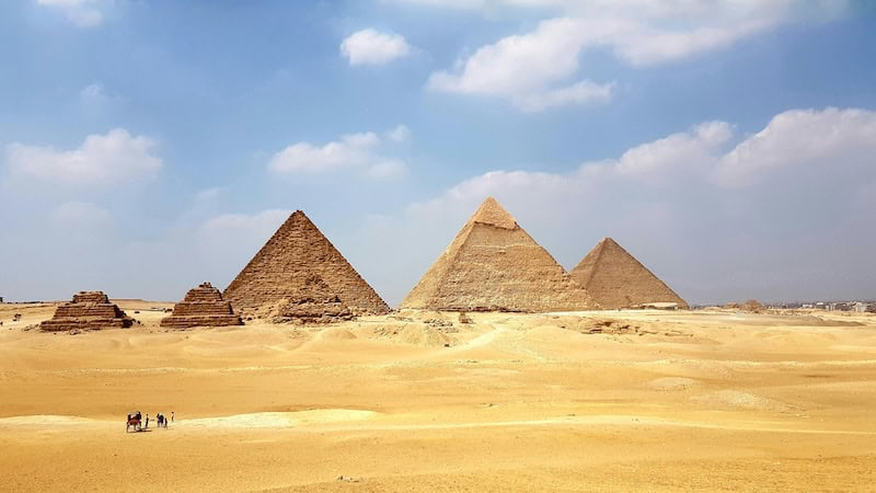 Pyramids of Giza rising from the desert in Cairo Egypt